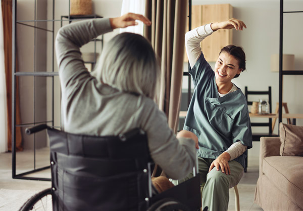 Physical therapist helping a person with mobility